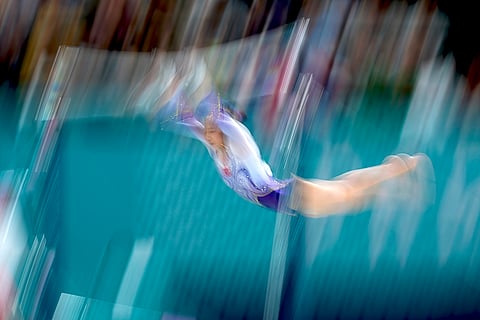 Qiu Qiyuan warms up during the women's artistic gymnastics